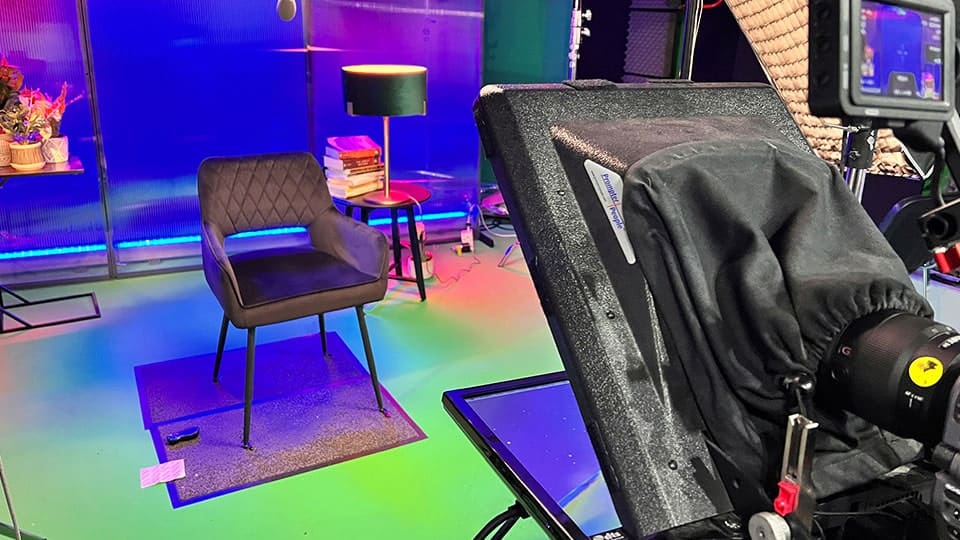Studio setup with chair and filming equipment for e-learning videos.