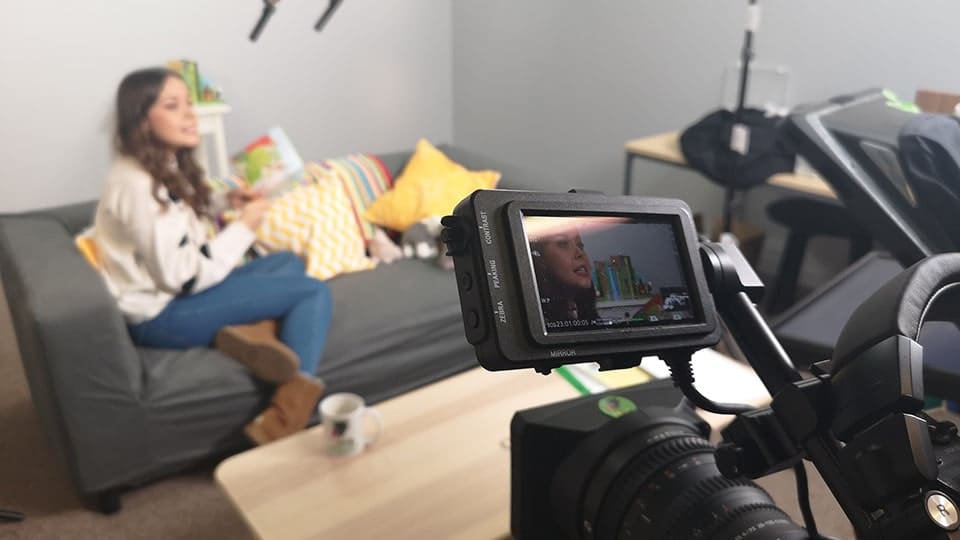 Recording a casual interview on a couch in Hush soundproof studio Manchester