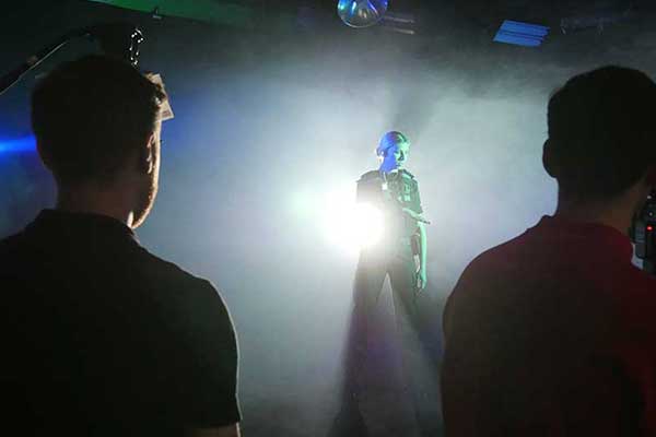Performer in blackout studio in Manchester session.